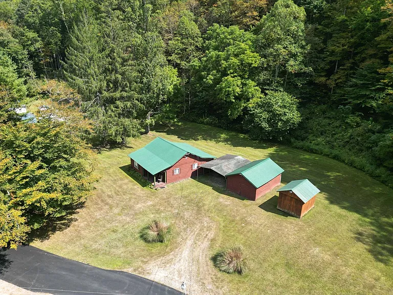 nestled on over 12 acres of untouched timberland